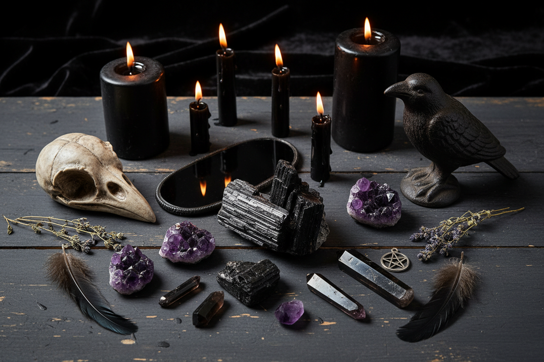 Protection crystals including black tourmaline, obsidian, smoky quartz, and amethyst displayed beside black candles and raven decor.