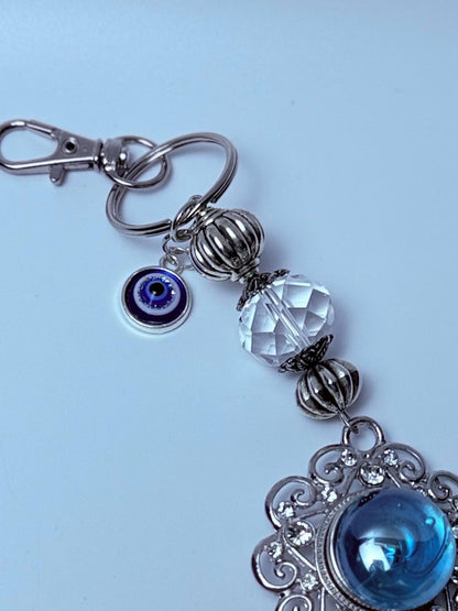 Blauer Edelstein Evil Eye Taschenanhänger: Boho Silberquaste, Feder & Kristall